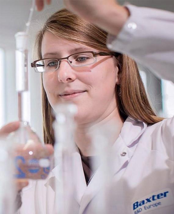 Baxter employees with Beaker in Lab